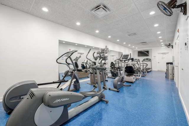 exercise room with a drop ceiling