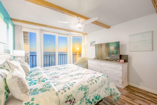 bedroom featuring ceiling fan, beamed ceiling, light wood-type flooring, and access to outside