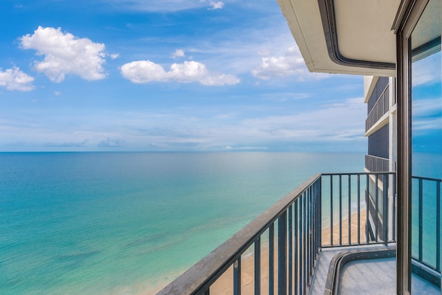 balcony featuring a water view