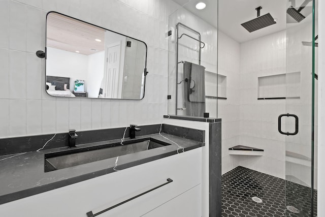 bathroom with vanity and an enclosed shower