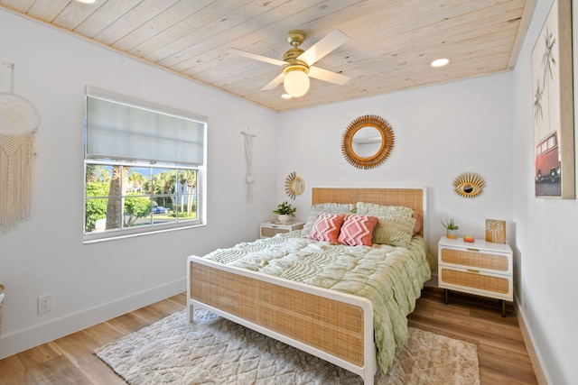 bedroom with wood ceiling, ceiling fan, and hardwood / wood-style floors