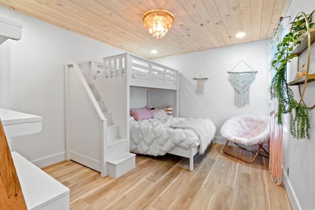 bedroom featuring wood ceiling and light hardwood / wood-style flooring