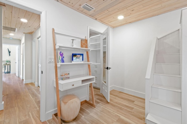 interior space with light wood-type flooring and wood ceiling