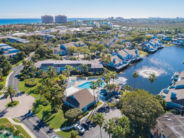 birds eye view of property with a water view