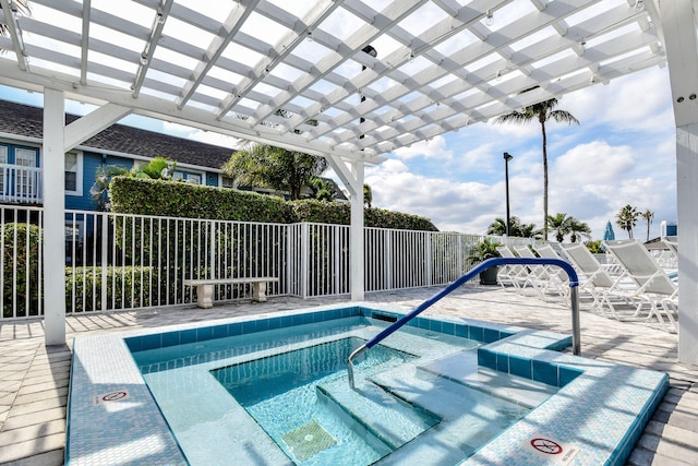 view of swimming pool featuring a hot tub and a pergola