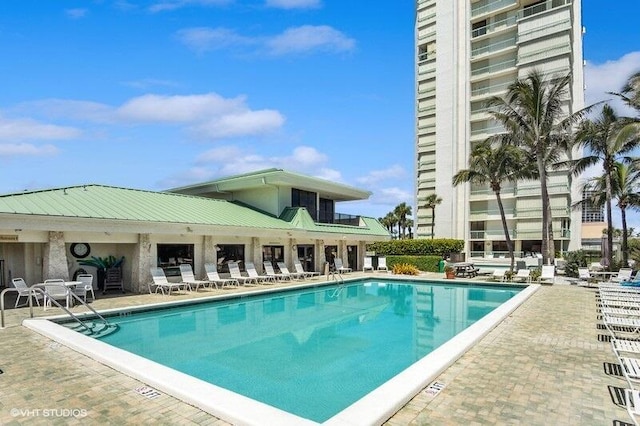 view of swimming pool featuring a patio area