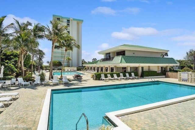 view of swimming pool featuring a patio area