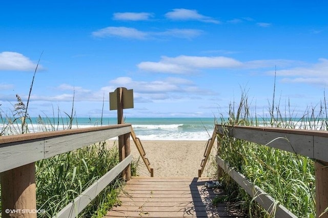 view of community with a view of the beach and a water view