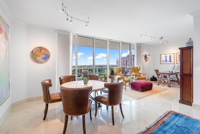 dining area featuring a wall of windows and crown molding