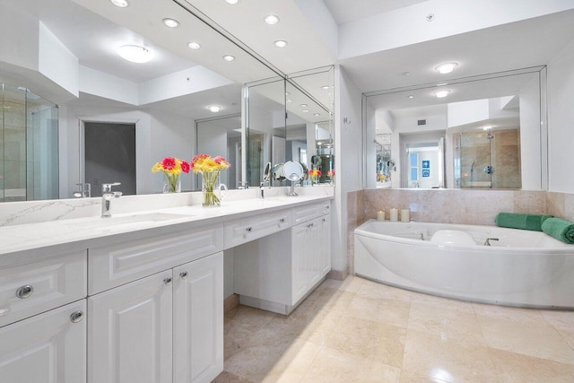 bathroom featuring tile patterned flooring, vanity, and plus walk in shower