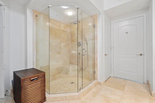 bathroom with tile patterned floors and an enclosed shower