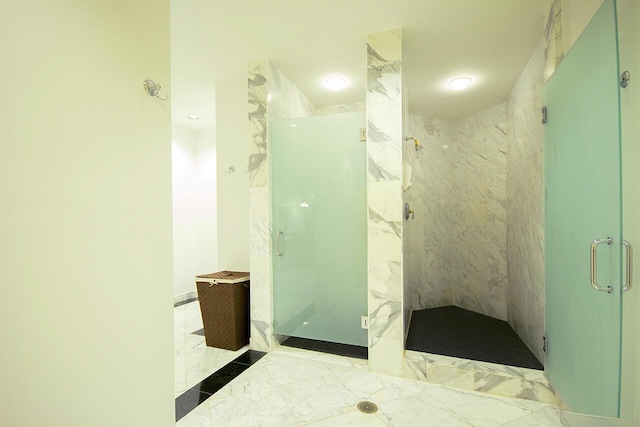 bathroom with a shower with shower door