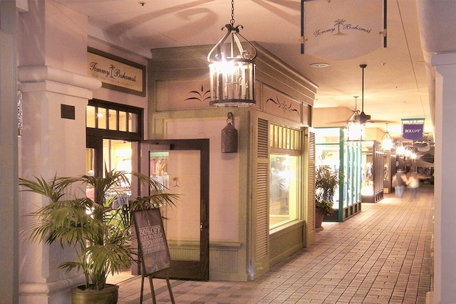 hall featuring a notable chandelier