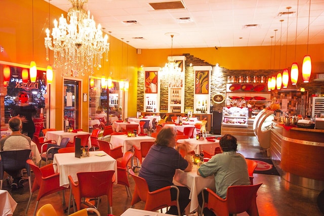 dining area featuring a notable chandelier