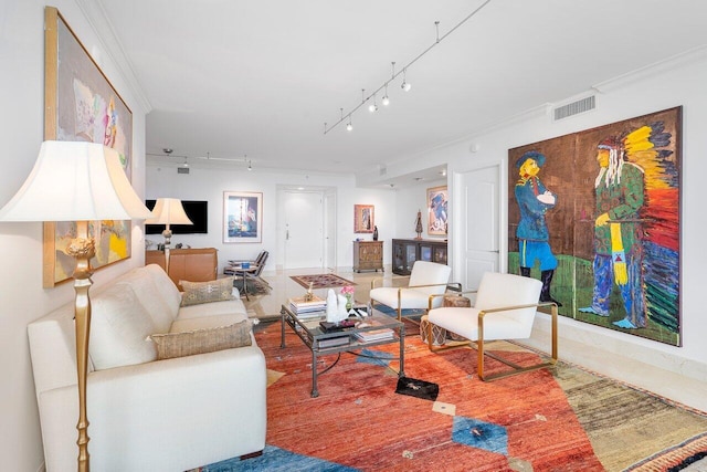 living room with track lighting and ornamental molding