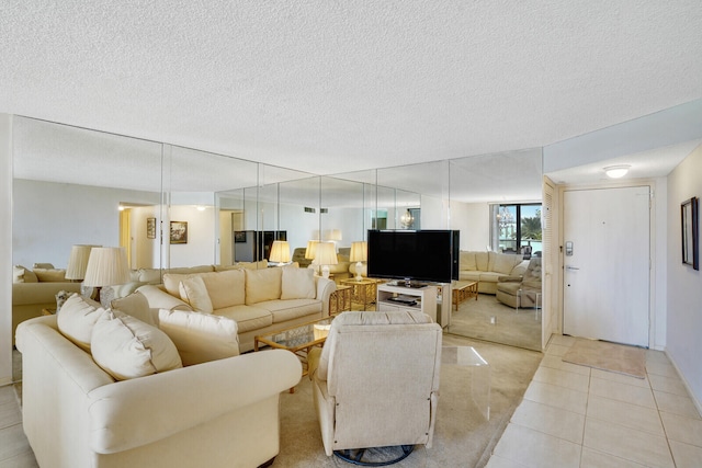 tiled living room featuring a textured ceiling