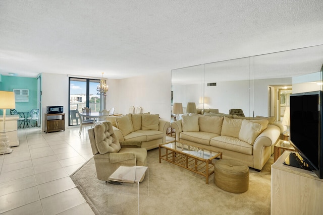 tiled living room with a wall of windows and a textured ceiling