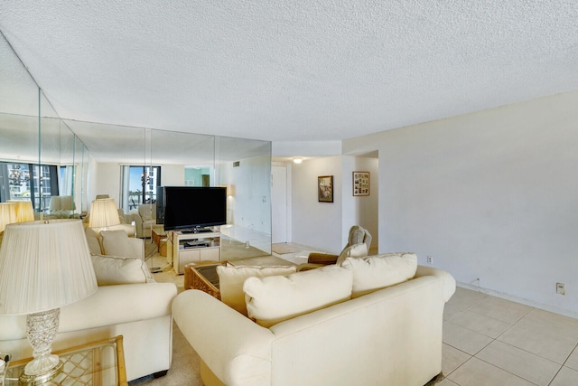 living room featuring a textured ceiling and light tile patterned flooring