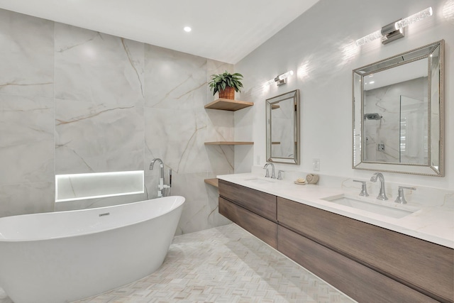 bathroom featuring vanity, separate shower and tub, and tile walls