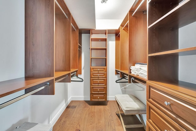 walk in closet featuring light wood-type flooring