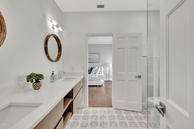 bathroom with vanity, toilet, a shower with door, and hardwood / wood-style flooring