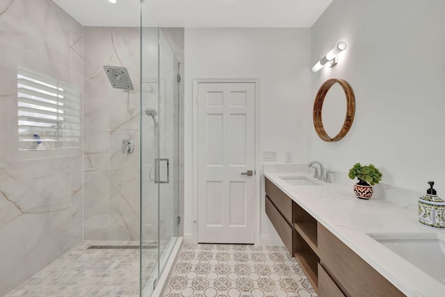 bathroom featuring walk in shower and vanity