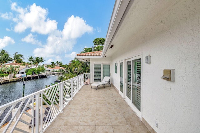 balcony featuring a water view