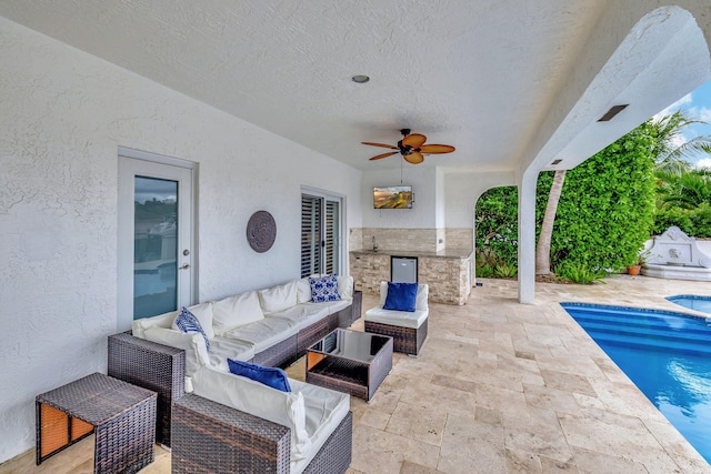 view of patio with ceiling fan and an outdoor hangout area