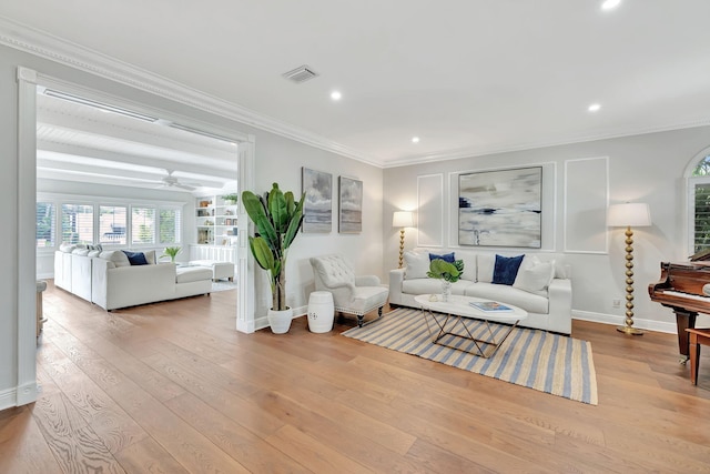 living room featuring ceiling fan, light hardwood / wood-style flooring, and ornamental molding