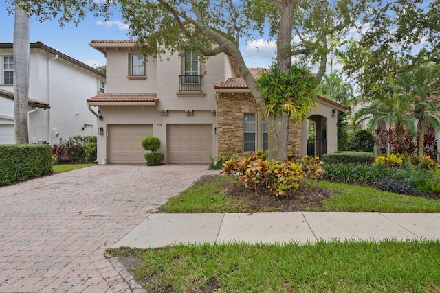 mediterranean / spanish-style home featuring a garage