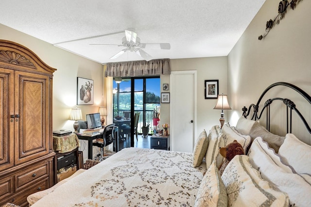 bedroom with a textured ceiling and ceiling fan