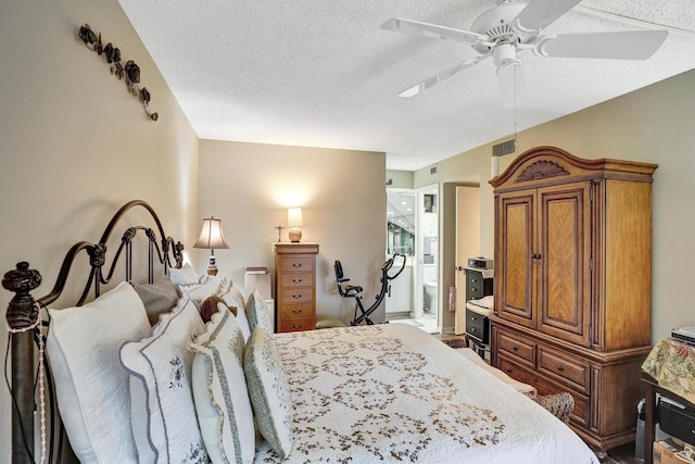 bedroom featuring a textured ceiling, ceiling fan, and ensuite bathroom