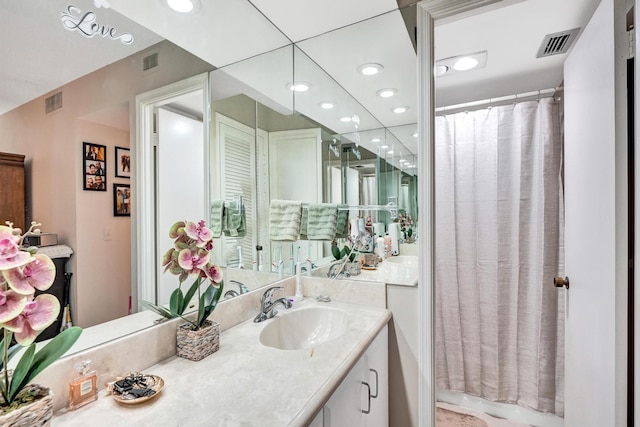 bathroom featuring vanity and a shower with shower curtain