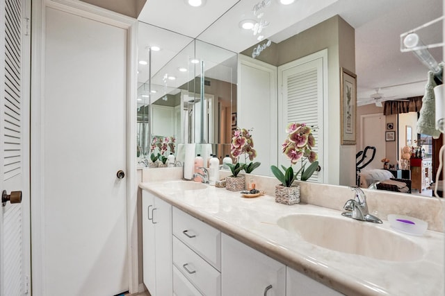 bathroom featuring vanity and ceiling fan