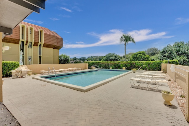 view of swimming pool featuring a patio