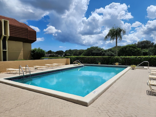 view of swimming pool featuring a patio