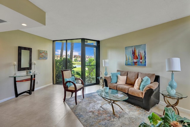 living room featuring floor to ceiling windows and light tile patterned floors