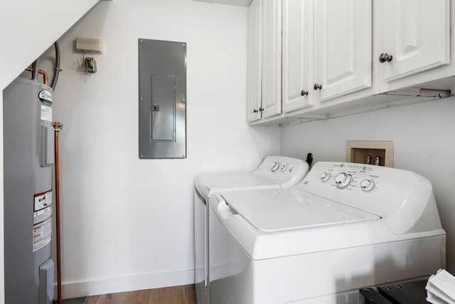 laundry area featuring water heater, cabinet space, washing machine and dryer, electric panel, and baseboards