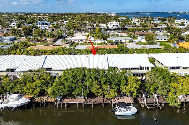 drone / aerial view featuring a water view and a residential view