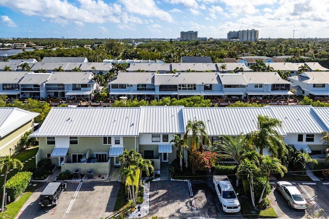 birds eye view of property with a residential view