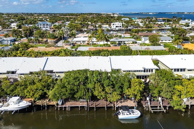 drone / aerial view with a water view and a residential view