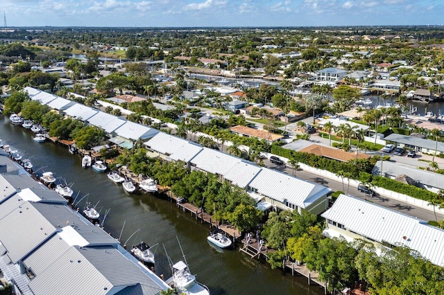 drone / aerial view featuring a residential view and a water view