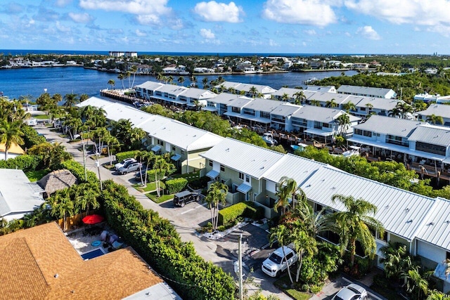 drone / aerial view with a water view and a residential view