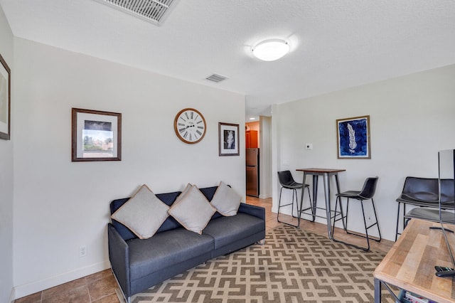 living room featuring a textured ceiling