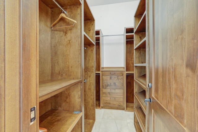 spacious closet featuring light tile patterned floors