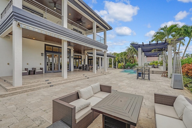 view of patio / terrace with a pergola, outdoor lounge area, and ceiling fan