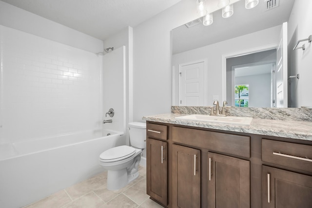 full bathroom with vanity, tiled shower / bath combo, toilet, and tile patterned flooring