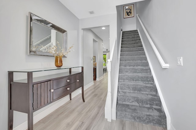 stairway featuring hardwood / wood-style flooring