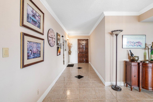 hall featuring a textured ceiling, light tile patterned floors, and ornamental molding