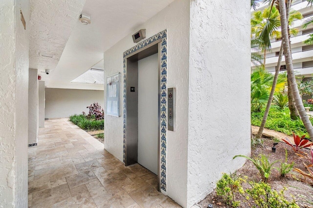 entrance to property featuring elevator